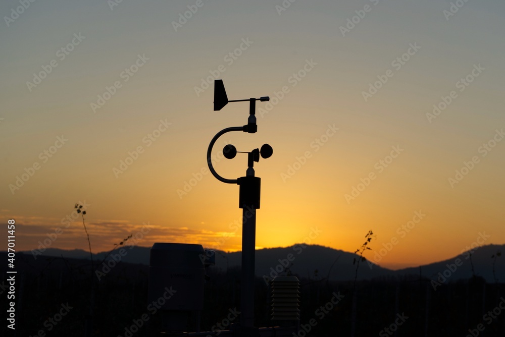 silhouette of a weatherstation during sunset