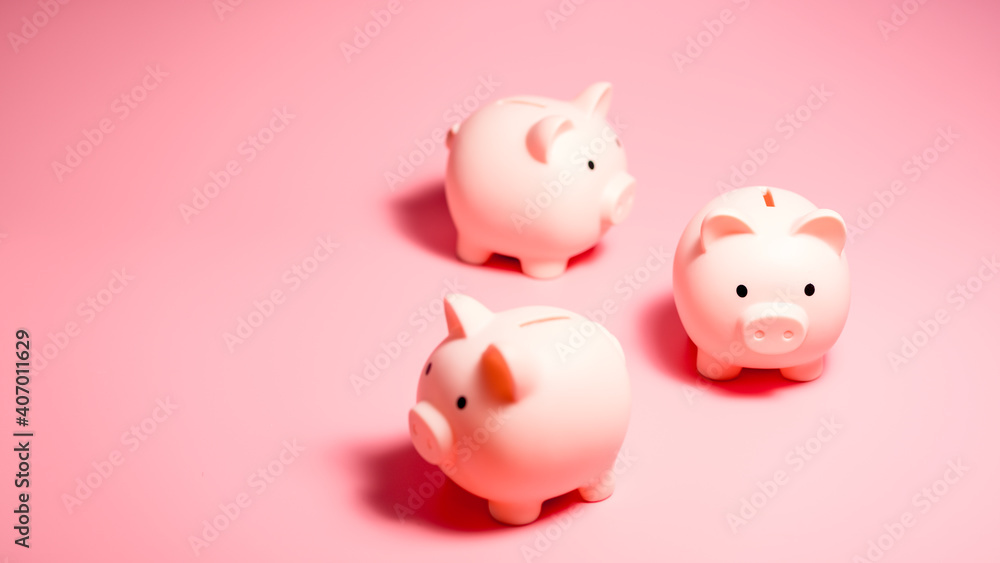 Piggy banks on isolated pink background with copy space. Money Saving Concepts