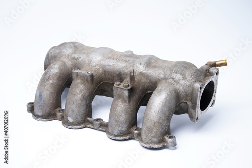 Intake manifold on a white background. Dirty air receiver and intake pipes.