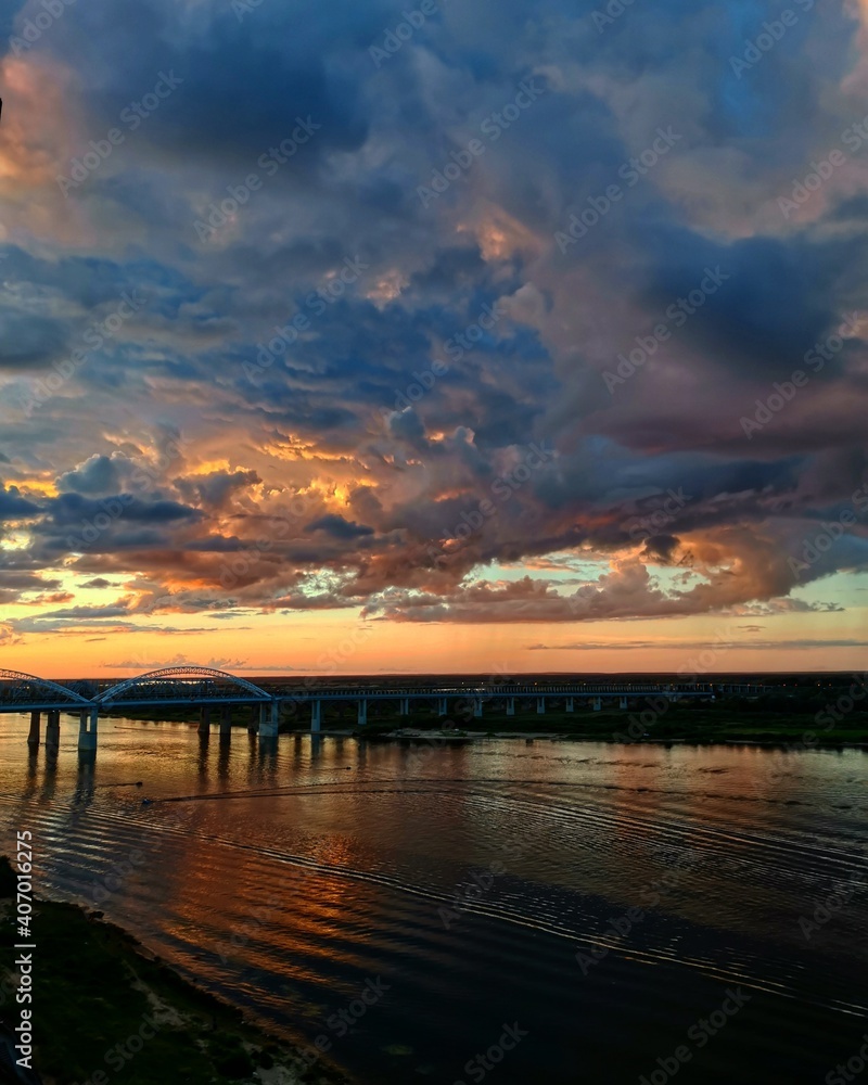 Naklejka premium sunset over the river