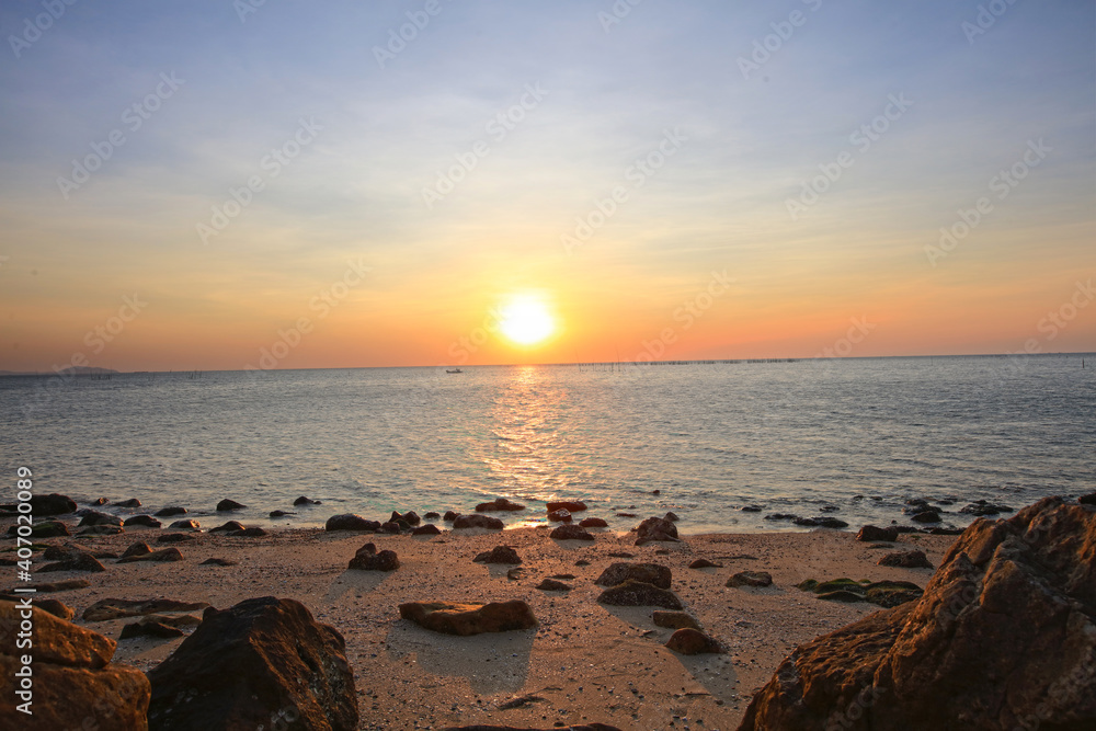 Fototapeta premium Natural sun set or sunrise over the sea , Sunset on blue ocean, The coast of Bangsean Chonburi, Thailand