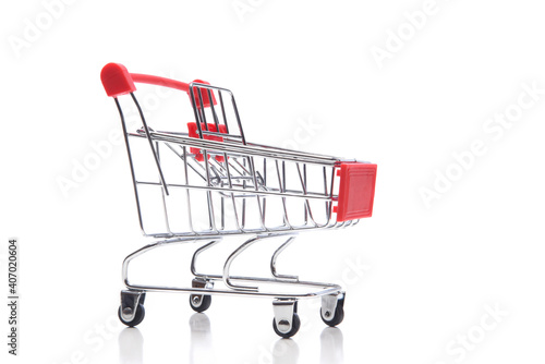 A supermarket shopping cart isolated on white.
