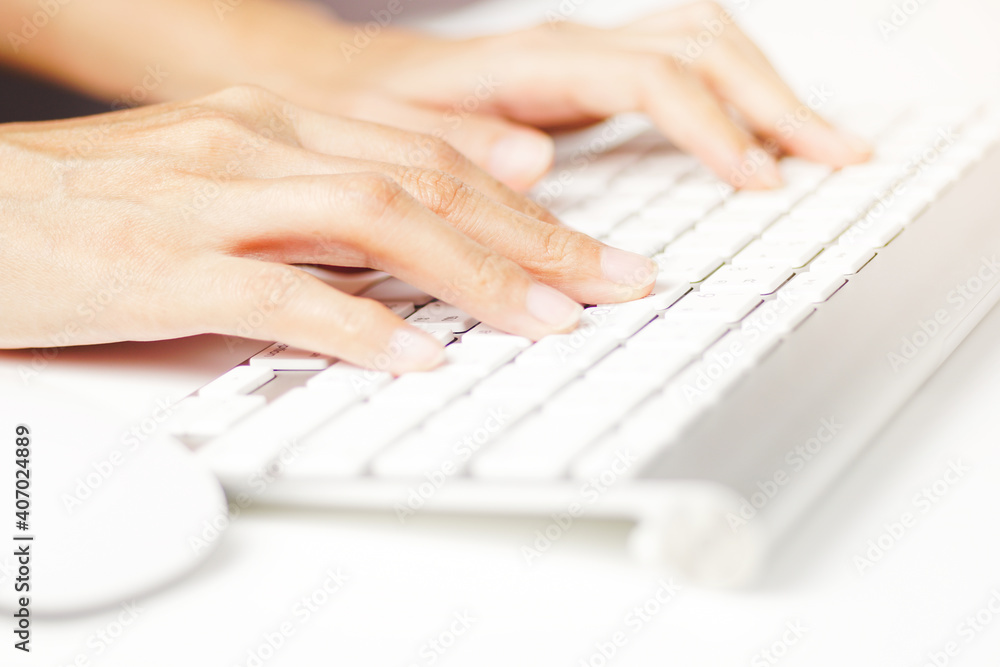 Working at home with laptop woman writing a blog.Hands of an office woman typing. Female hands on the keyboard. Working at home with laptop woman writing a blog.Hands of an office woman typing. Female hands on the keyboard.