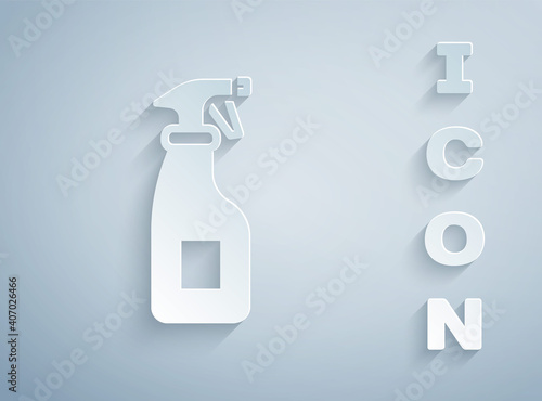 Paper cut Cleaning spray bottle with detergent liquid icon isolated on grey background. Paper art style. Vector.