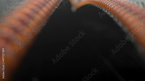 Going through inside the black luggage bag while opening the orange zipper in Estonia