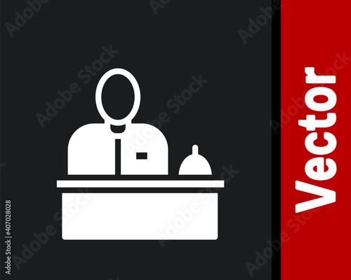 White Receptionist standing at hotel reception desk icon isolated on black background. Vector.