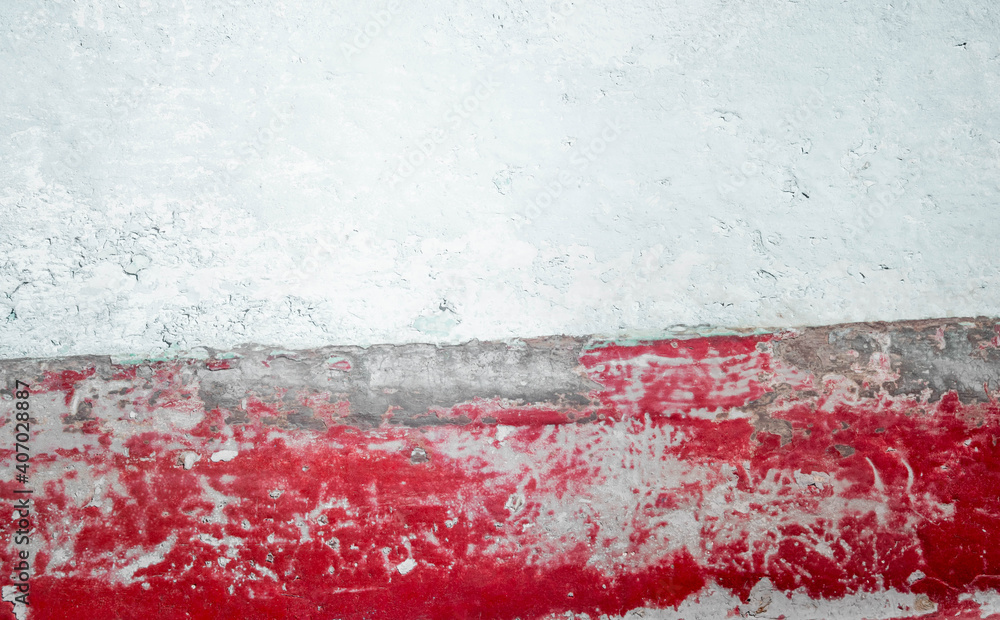 Old wall painted red and white, damaged flag of Poland. Symbol of political and other problems in Poland. Background for polish protest slogans and posters.