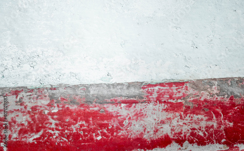 Old wall painted red and white, damaged flag of Poland. Symbol of political and other problems in Poland. Background for polish protest slogans and posters.
