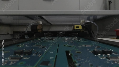 first-person perspective (FPP) camera view for a printed circuit board that entering reflow oven for the cooking process photo