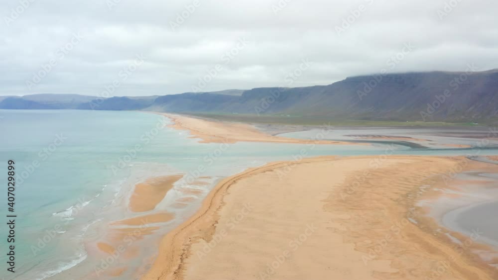 Iceland Ocean Water with orange red sand Beach shot with Aerial Drone on Rauðisandur and Hills Iceland Ocean Water with orange red sand Beach shot with Aerial Drone on Rauðisandur and Hills