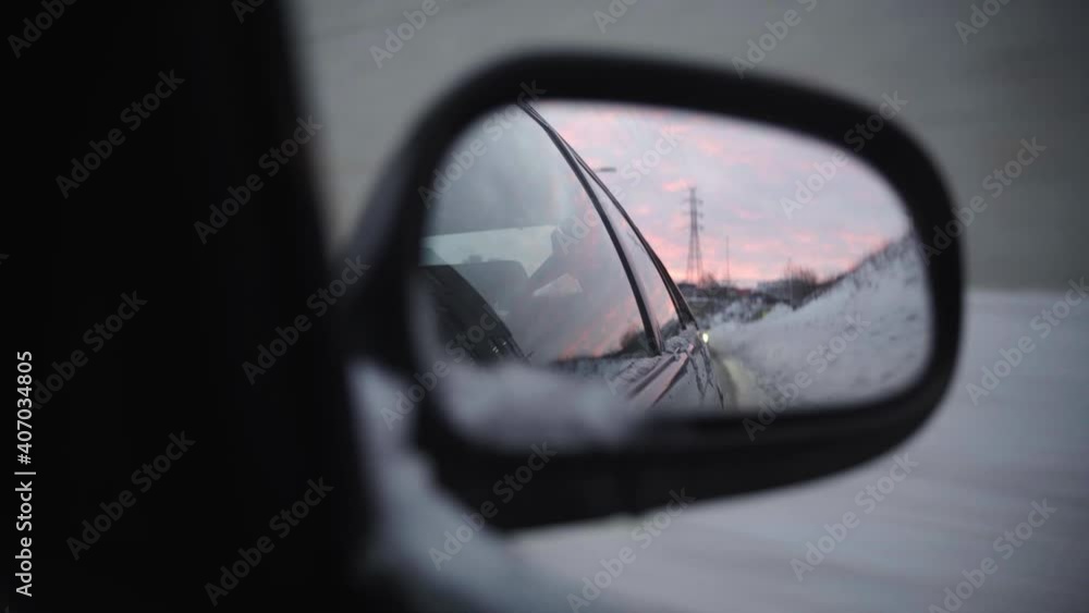 Reflection of a car window on the road during sunset Reflection of a car window on the road during sunset