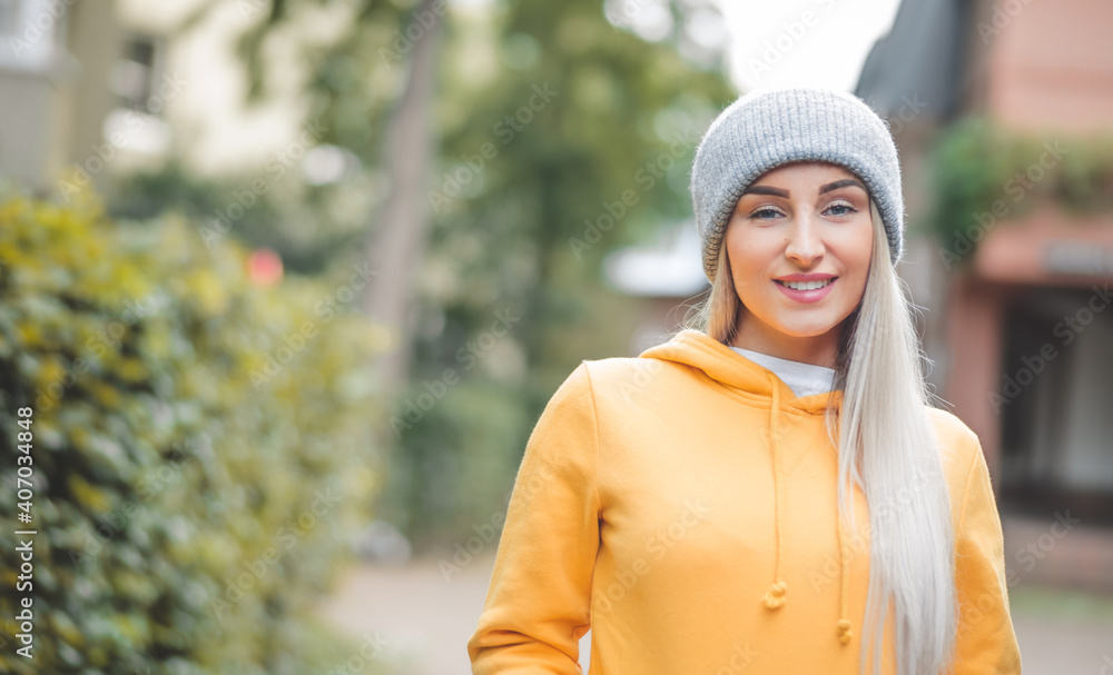 Portrait of beautiful young woman with smile face looking at camera. Outdoors daylight. Cute girl wearing casual clothing. Outside Portrait of beautiful young woman with smile face looking at camera. Outdoors daylight. Cute girl wearing casual clothing. Outside