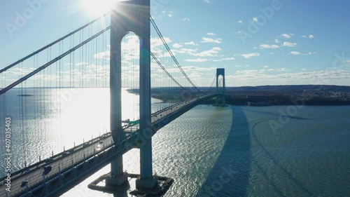 Aerial Drone Shot Flying Next to Deck of the Verrazano Bridge in New York City photo