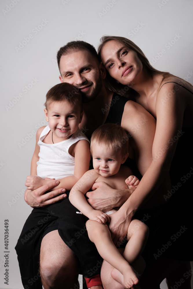 Portrait of a beautiful young family. Dad, mom, two children