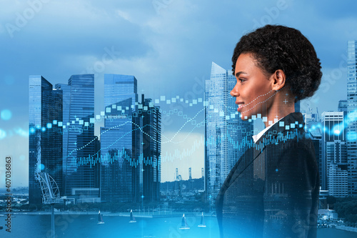 Attractive black woman trader and stock market analyst in suit dreaming about market behavior and forecast in crisis. Women in business concept. Forex chart. Singapore. Double exposure.