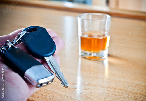 Alcoholic drink, breathalyzer and car keys - do not drink and drive concept photo