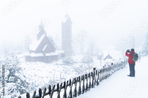 Kościół Wang Church in the town of Karpacz in southern Poland is a religious building brought from the Nordic countries as a gift to Poland. Picture with heavy fog and blizzard of snow and ice.
