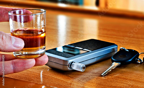 Alcoholic drink, breathalyzer and car keys - do not drink and drive concept