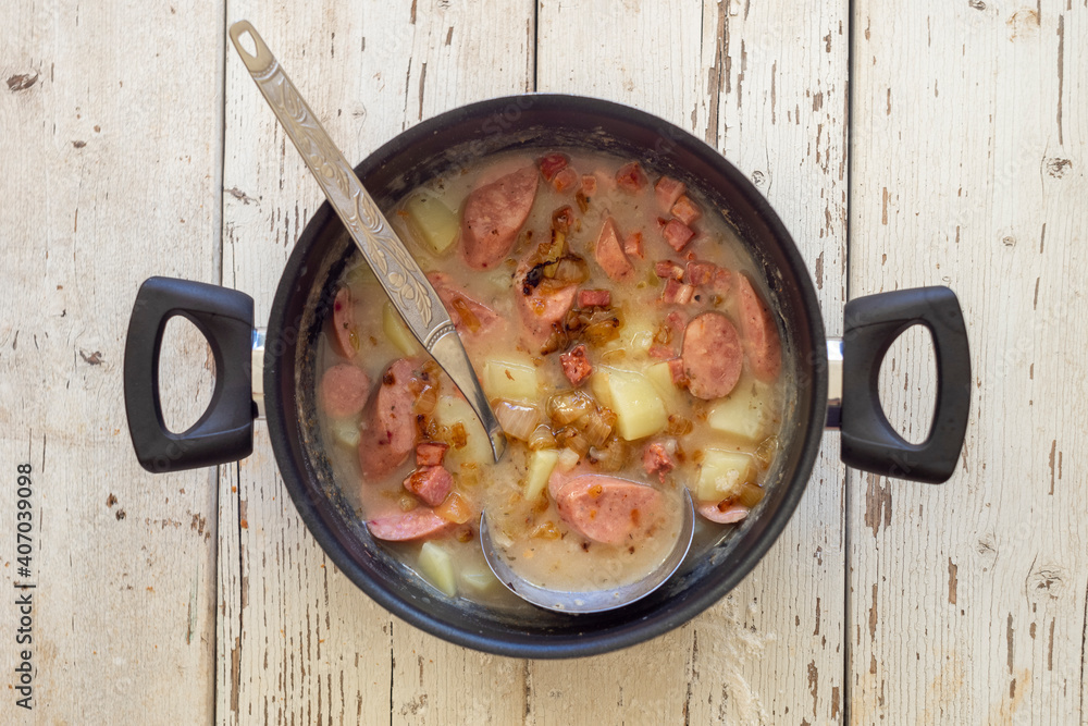Traditional polish sour soup on wooden background