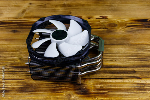 Modern CPU cooler on a wooden desk photo