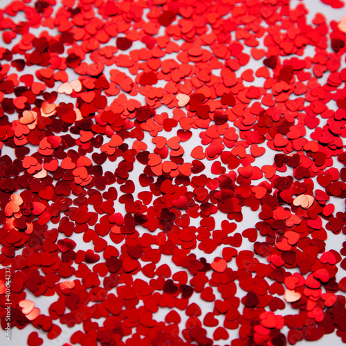 Scattered glitter little red hearts. Valentines background
