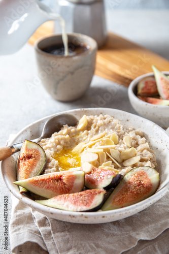 Healthy Oatmeal with figs. Coffee  oatmeal breakfast concept