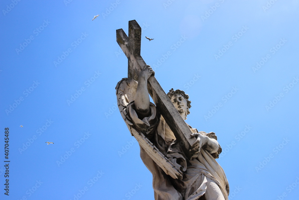 Statue of an angel with a cross