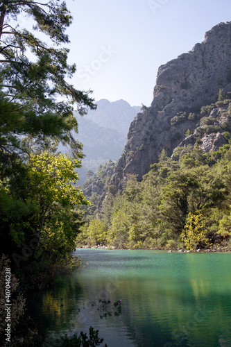Lake with blue and green water is surrounded by rocks in canyon Goynuk  Kemer district in Antalya Province  Turkey.