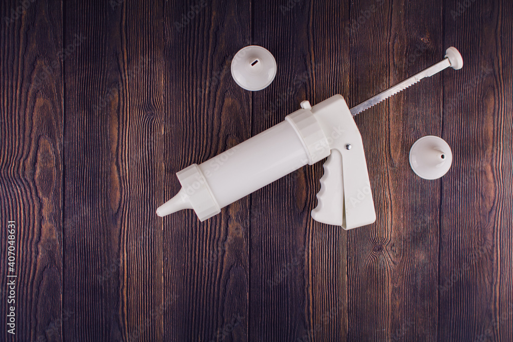 Obraz premium pastry syringe with molds for cream and cookies