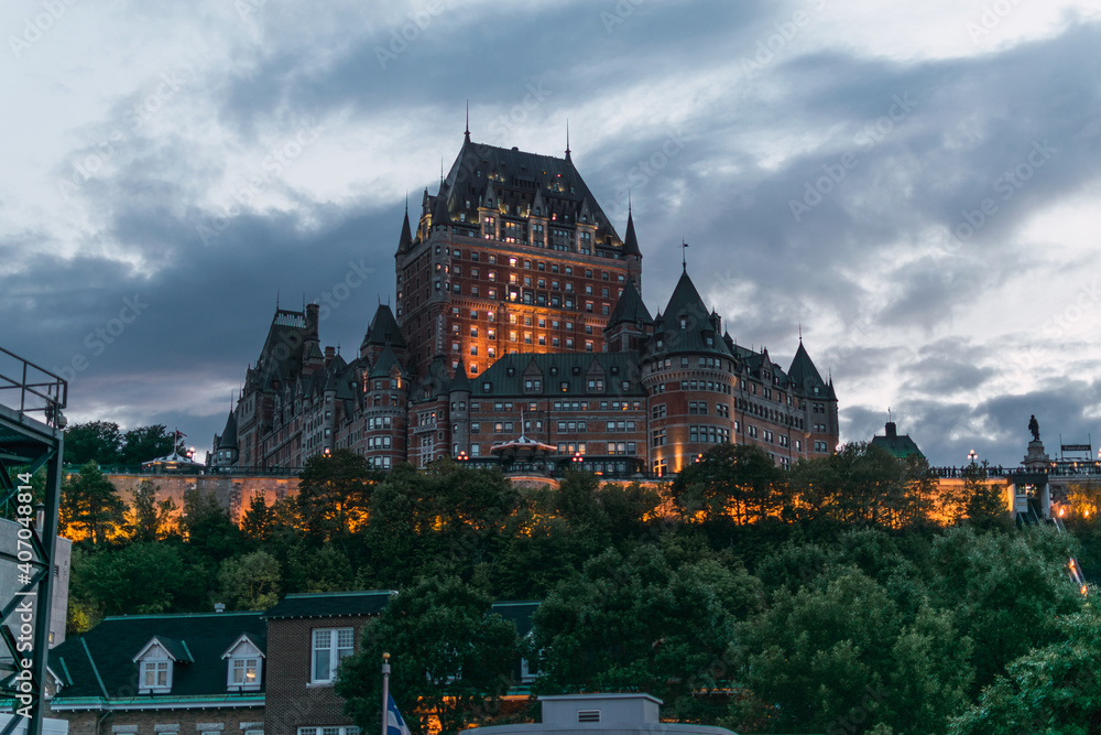 Fototapeta premium Panoramic view of the Frontenac hotel at sunset in the blue hour in Quebec, Canada
