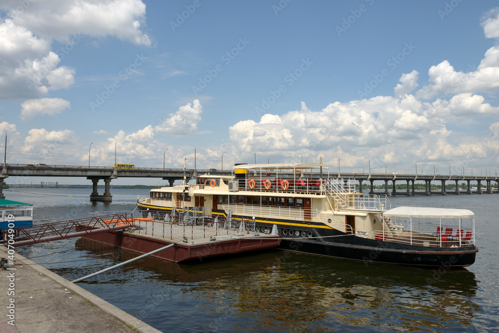 Boat is moored near embankment in Dnepr town, Ukraine. Boat is moored near embankment in Dnepr town, Ukraine.
