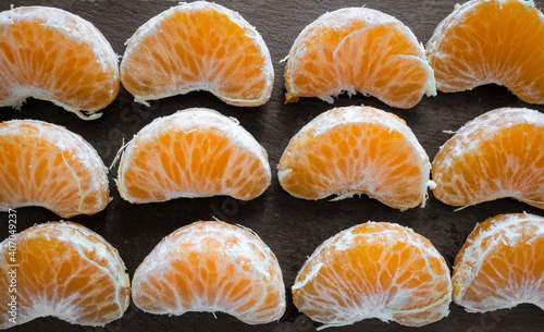 Close-up of some natural, fresh, healthy and tasty orange segments.