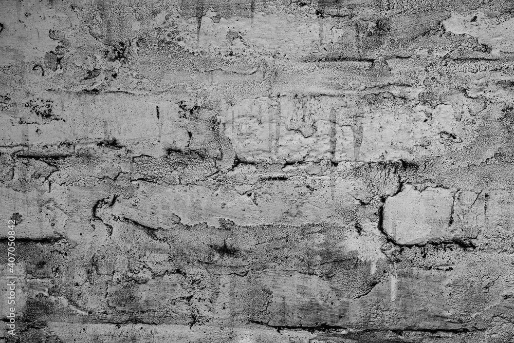 Obraz premium Texture of a brick wall with cracks and scratches which can be used as a background