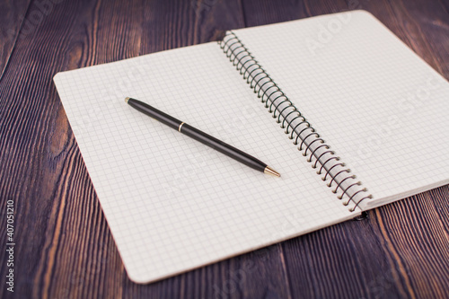 Wallpaper Mural notebook with pen on a wooden table Torontodigital.ca