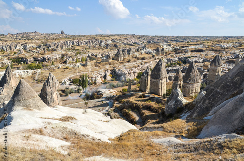 View from the observation deck to strange beautiful landscape with majestic rock formations at Goreme, Cappadocia, Turkey