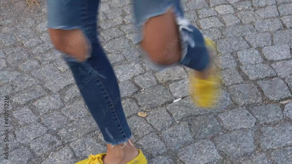 Young dancing in the street with a skateboard in his hand. woman Young dancing in the street with a skateboard in his hand. woman