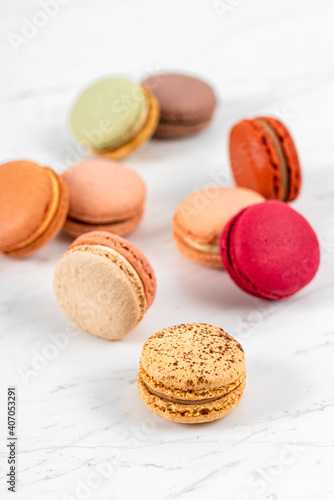 Colorful Fruity Macarons Flat Lay and Top View on White Marble Table