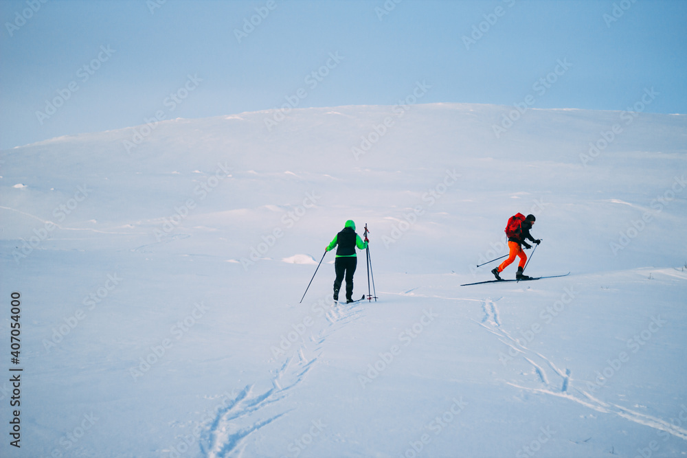 group of people walking in the snow