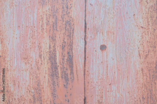 Scratched red-painted metal background. Abstract vintage texture.