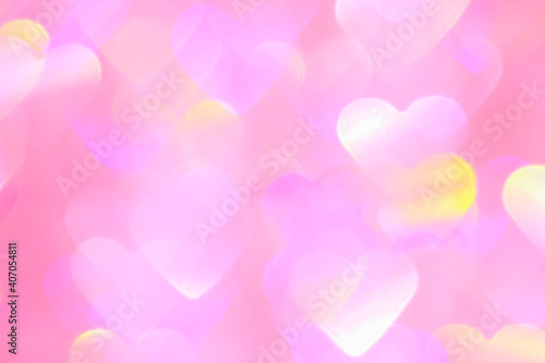 blurred heart shaped holographic bokeh lights background
