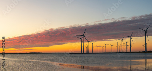 Mega Wind turbines at sunset in Philipsdam, the Netherlands at sea side photo