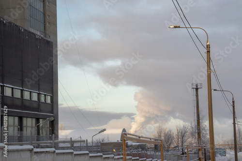 Emissions from a pipe on a winter day against a blue sky © Svetlana