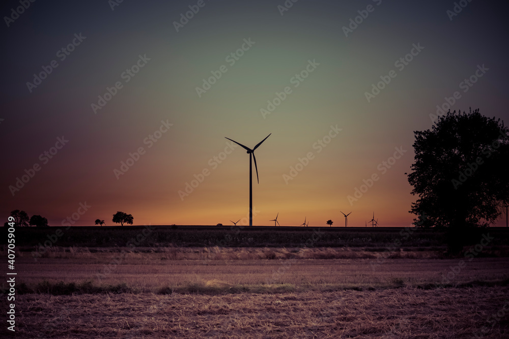 silhouette landscape with wind turbines