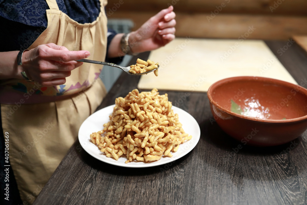 Cook puts chak-chak on plate Cook puts chak-chak on plate