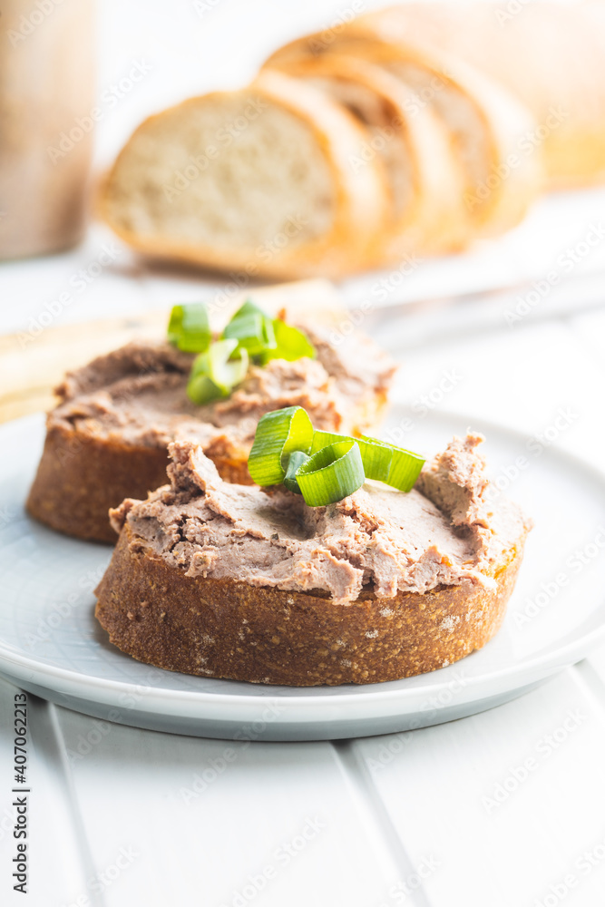 Liver pate on sliced baguette. Liver pate on sliced baguette.