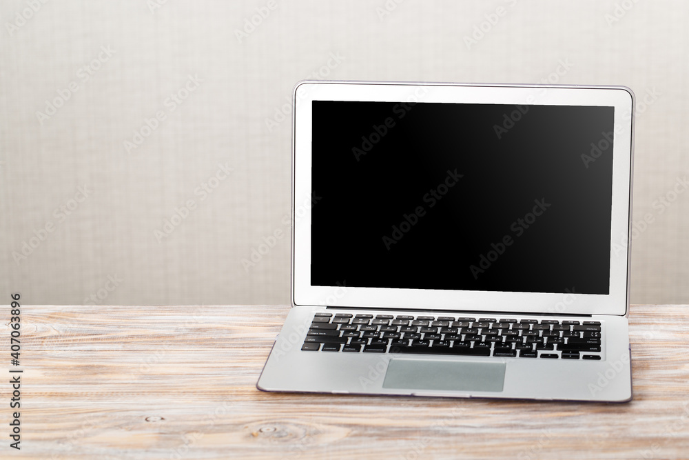 Laptop with blank screen for product display in office with modern blurred background Laptop with blank screen for product display in office with modern blurred background