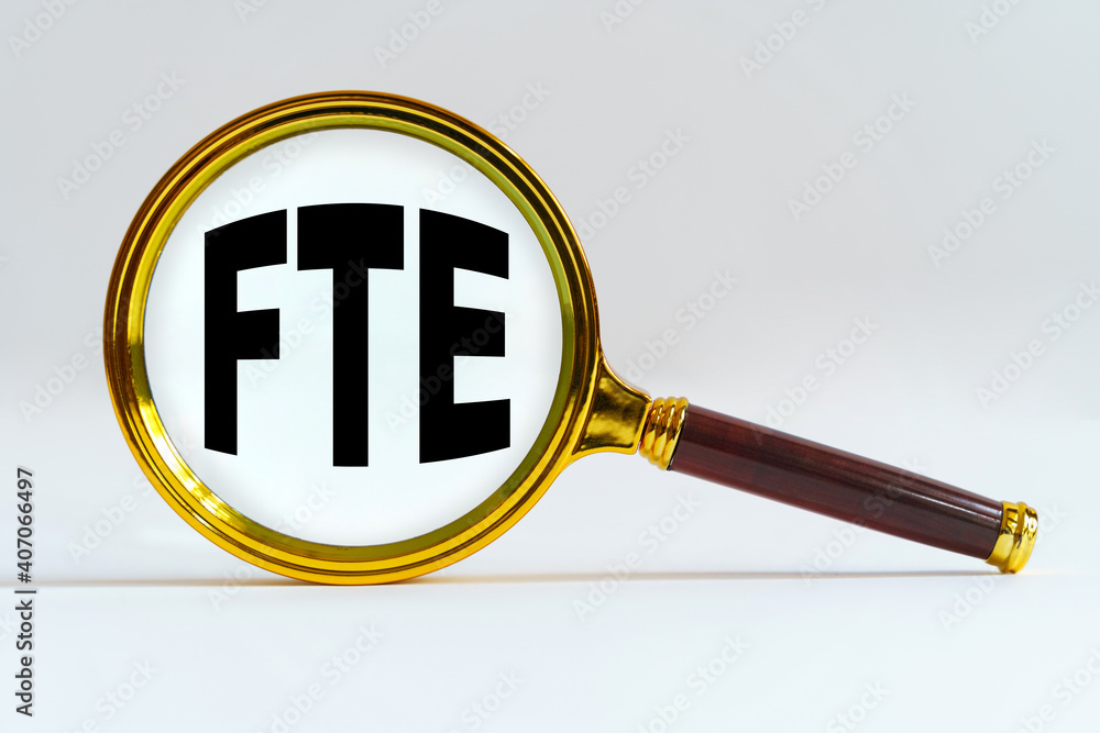 Magnifier on a white background, inside the text is written - FTE Magnifier on a white background, inside the text is written - FTE