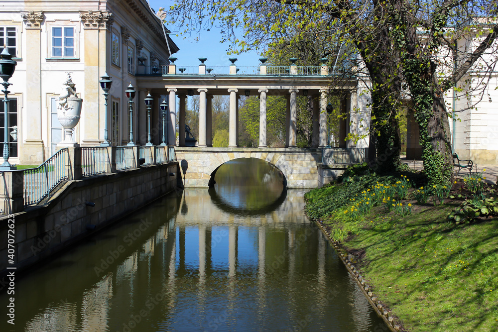 Bridge in Warsaw city park, Lazienki park. Royal baths Park in Warsaw in spring. Selective focus.