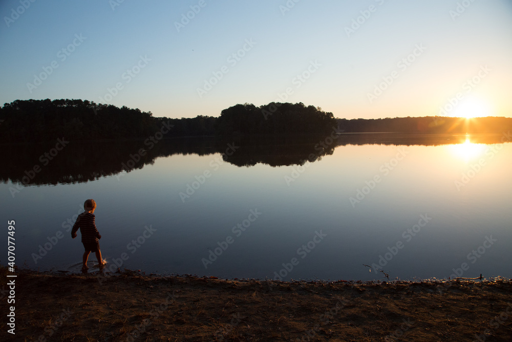 Fototapeta premium sunset as child plays