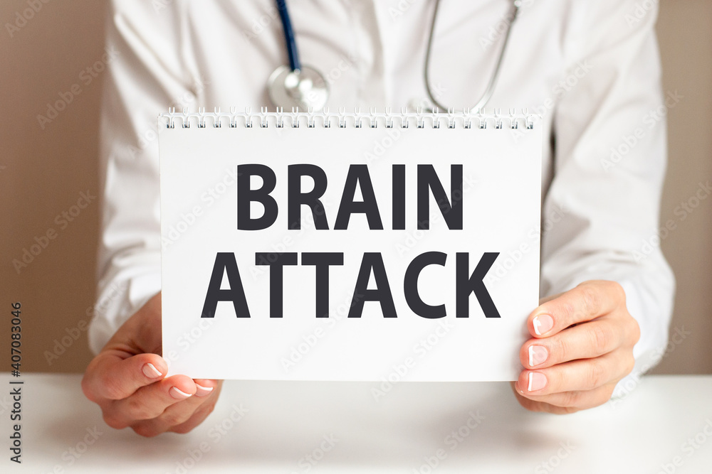 Doctor holding a paper plate with text Brain Attack, medical concept Doctor holding a paper plate with text Brain Attack, medical concept